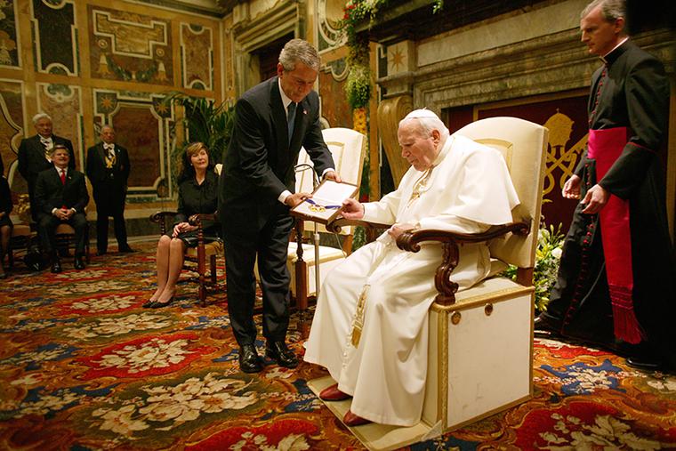 President George W. Bush presents the Medal of Freedom to Pope John Paul II June 4, 2004, during a visit to the Vatican. President George W. Bush presents the Medal of Freedom to Pope John Paul II June 4, 2004, during a visit to the Vatican.