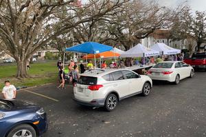 Cars line up to receive food and supplies at St. Charles Borromeo Church in Destrehan, Louisiana, in the days following Hurricane Ida. Cars line up to receive food and supplies at St. Charles Borromeo Church in Destrehan, Louisiana, in the days following Hurricane Ida.