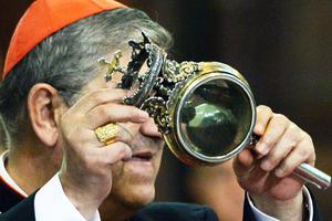 Cardinal Crescenzio Sepe displays the ampulla containing the blood of San Gennaro (St. Januarius) on March 21, 2015, in Naples. Cardinal Crescenzio Sepe displays the ampulla containing the blood of San Gennaro (St. Januarius) on March 21, 2015, in Naples.