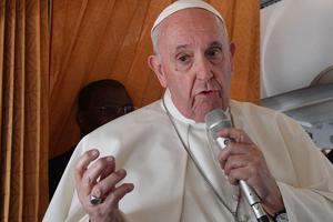 Pope Francis speaks with journalists aboard an airplane from Bratislava, Slovakia, to Rome on Sept. 15. Pope Francis speaks with journalists aboard an airplane from Bratislava, Slovakia, to Rome on Sept. 15.