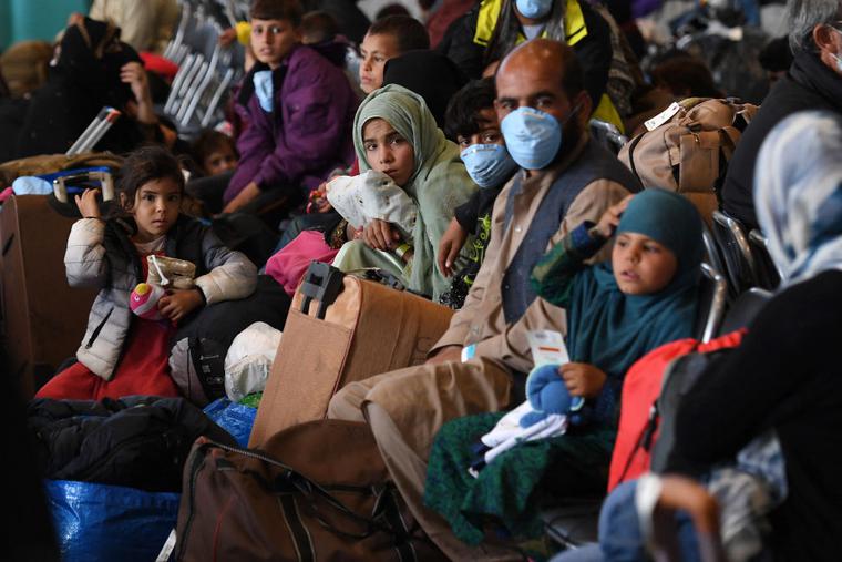 Afghan refugees are being processed inside Hangar 5 at Ramstein Air Base in Germany on Sept. 8. Afghan refugees are being processed inside Hangar 5 at Ramstein Air Base in Germany on Sept. 8.