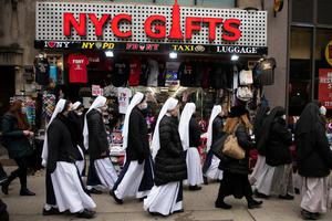 “NYC Gifts” — Sisters of Life walk up Seventh Avenue in Manhattan on their way to Mass at Old St. Patrick’s Cathedral, from where they would process with others to the Margaret Sanger Planned Parenthood for a monthly witness. The monthly prayer and sidewalk counseling at the abortion center continued through the pandemic, as did the abortions. The religious order was founded in the Archdiocese of New York 30 years ago by Cardinal John O’Connor. “NYC Gifts” — Sisters of Life walk up Seventh Avenue in Manhattan on their way to Mass at Old St. Patrick’s Cathedral, from where they would process with others to the Margaret Sanger Planned Parenthood for a monthly witness. The monthly prayer and sidewalk counseling at the abortion center continued through the pandemic, as did the abortions. The religious order was founded in the Archdiocese of New York 30 years ago by Cardinal John O’Connor.