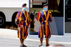 Two Swiss guards pose for a photo wearing masks amid the COVID pandemic. Two Swiss guards pose for a photo wearing masks amid the COVID pandemic.