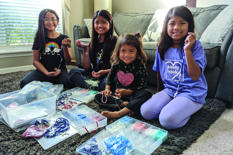 Abigail, Marigrace, Patricia and Josephine Quicho enjoy making rosaries. Abigail, Marigrace, Patricia and Josephine Quicho enjoy making rosaries.