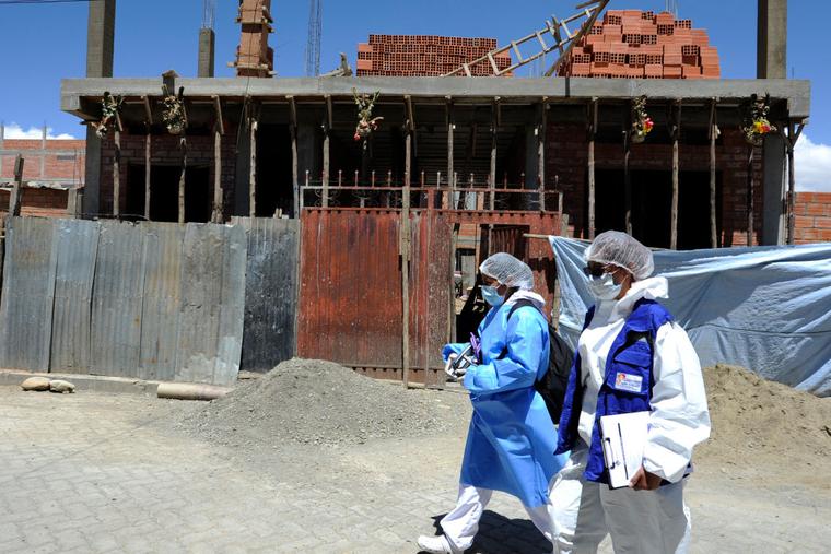 Health personnel of the Bolivian Health Ministry walk at Santa Rosa neighborhood to vaccinate people against COVID-19 home by home in El Alto, Bolivia, on September 17, 2021. Health personnel of the Bolivian Health Ministry walk at Santa Rosa neighborhood to vaccinate people against COVID-19 home by home in El Alto, Bolivia, on September 17, 2021.