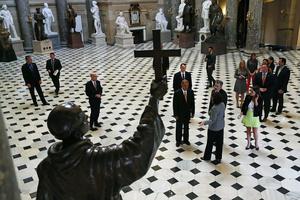 House Speaker John Boehner (R-OH) (C) walks through Statuary Hall in Washington, DC, in front of the statue of Junípero Serra on Sept. 16, 2015. House Speaker John Boehner (R-OH) (C) walks through Statuary Hall in Washington, DC, in front of the statue of Junípero Serra on Sept. 16, 2015.