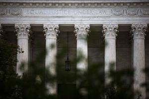 The U.S. Supreme Court is seen on Oct. 5 in Washington. The high court is holding in-person arguments for the first time since the start of the COVID-19 pandemic. The U.S. Supreme Court is seen on Oct. 5 in Washington. The high court is holding in-person arguments for the first time since the start of the COVID-19 pandemic.