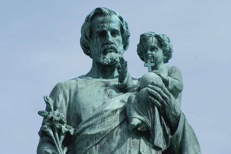 Statue of St. Joseph holding the Child Jesus. Statue of St. Joseph holding the Child Jesus.