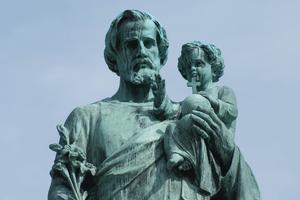 Statue of St. Joseph holding the Child Jesus. Statue of St. Joseph holding the Child Jesus.