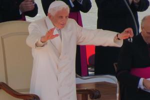 Pope Benedict XVI stands to show his thanks after a standing ovation from the audience. Pope Benedict XVI stands to show his thanks after a standing ovation from the audience.