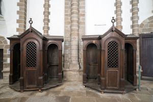 Confessionals in the Abbey Sainte-Croix in Quimperle, Brittany. Confessionals in the Abbey Sainte-Croix in Quimperle, Brittany.