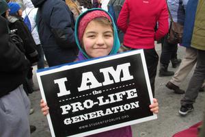 A girl holds a sign at the March for Life rally in Washington, D.C. A girl holds a sign at the March for Life rally in Washington, D.C.