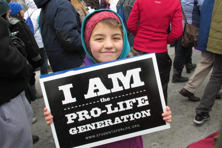 A girl holds a sign at the March for Life rally in Washington, D.C. A girl holds a sign at the March for Life rally in Washington, D.C.