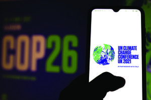 A photo illustration of the 2021 United Nations Climate Change Conference (COP26) logo is seen displayed on a smartphone. A photo illustration of the 2021 United Nations Climate Change Conference (COP26) logo is seen displayed on a smartphone.