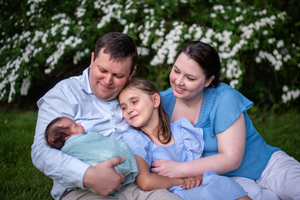 Sarah and Ed Mullen, along with daughter Dorothy, gaze lovingly at their new addition: daughter Annie. Sarah and Ed Mullen, along with daughter Dorothy, gaze lovingly at their new addition: daughter Annie.