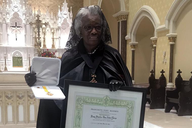 Pearlie Harris holds her Benemerenti medal and certificate Pearlie Harris holds her Benemerenti medal and certificate