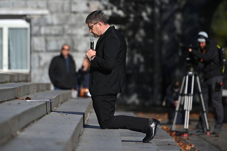 Archbishop of Reims Eric de Moulins-Beaufort kneels as a sign of penance during a ceremony at the sanctuary of Lourdes towards victims of pedocriminality in Lourdes, south-western France on November 6, 2021. Archbishop of Reims Eric de Moulins-Beaufort kneels as a sign of penance during a ceremony at the sanctuary of Lourdes towards victims of pedocriminality in Lourdes, south-western France on November 6, 2021.