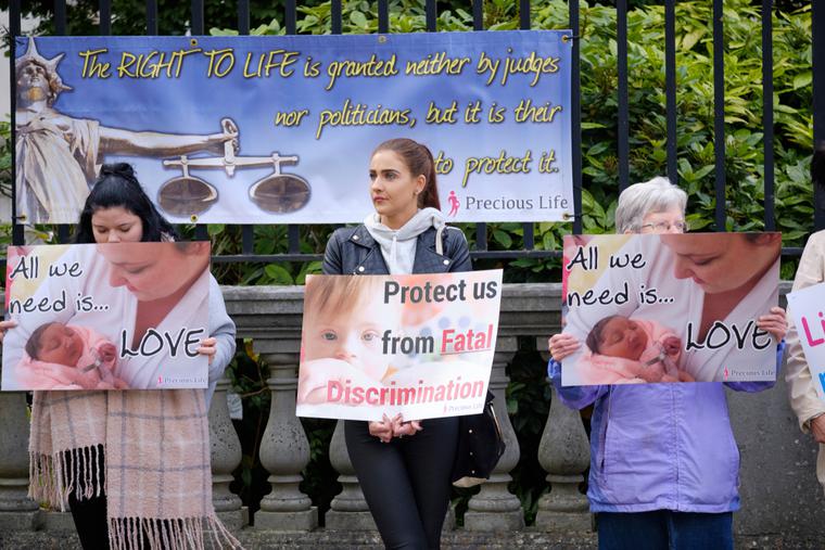 Pro life protesters outsider the Belfast High court with signs, as Northern Ireland abortion laws are being challenged. Pro life protesters outsider the Belfast High court with signs, as Northern Ireland abortion laws are being challenged.
