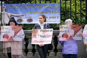 Pro life protesters outsider the Belfast High court with signs, as Northern Ireland abortion laws are being challenged. Pro life protesters outsider the Belfast High court with signs, as Northern Ireland abortion laws are being challenged.