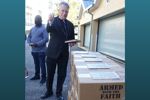 Archbishop Timothy Broglio of the Archdioceses for the Military Services blesses copies of the prayer book on Nov. 9 in Washington, D.C. Archbishop Timothy Broglio of the Archdioceses for the Military Services blesses copies of the prayer book on Nov. 9 in Washington, D.C.