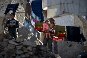 Children stand in front of their house in the old quarters of Kabul on November 8, 2021. Children stand in front of their house in the old quarters of Kabul on November 8, 2021.