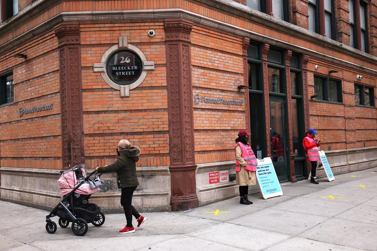 A woman pushes a stroller April 16 past the Planned Parenthood in the Financial District neighborhood of Manhattan in New York City. A woman pushes a stroller April 16 past the Planned Parenthood in the Financial District neighborhood of Manhattan in New York City.