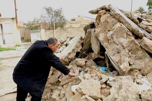 Chaldean Father Thabet Mekko pokes through the rubble that was once his family home on March 18, 2017. Chaldean Father Thabet Mekko pokes through the rubble that was once his family home on March 18, 2017.