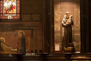 Candles illuminate the Blessed Mother and St. Anthony of Padua inside Saint-Sernin Church in Toulouse, France. Candles illuminate the Blessed Mother and St. Anthony of Padua inside Saint-Sernin Church in Toulouse, France.