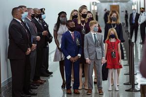 Accompanied by her seven children, Amy Coney Barrett arrives Oct. 12, 2020, for her Senate Judiciary Committee confirmation in Washington, DC. Accompanied by her seven children, Amy Coney Barrett arrives Oct. 12, 2020, for her Senate Judiciary Committee confirmation in Washington, DC.