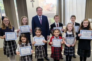 Students who are all winners of the St. Joseph art contest stand alongside Thomas Carroll, superintendent of schools for the Archdiocese of Boston. Students who are all winners of the St. Joseph art contest stand alongside Thomas Carroll, superintendent of schools for the Archdiocese of Boston.