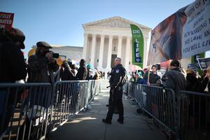 Police use metal barricades to keep protesters, demonstrators and activists apart in front of the U.S. Supreme Court building as the justices hear hear arguments in Dobbs v. Jackson Women's Health, a case about a Mississippi law that bans most abortions after 15 weeks, on Dec. 1 in Washington, DC. Police use metal barricades to keep protesters, demonstrators and activists apart in front of the U.S. Supreme Court building as the justices hear hear arguments in Dobbs v. Jackson Women's Health, a case about a Mississippi law that bans most abortions after 15 weeks, on Dec. 1 in Washington, DC.