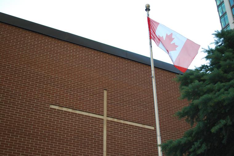 A Canadian flag is seen flying at a Catholic school in Toronto. A Canadian flag is seen flying at a Catholic school in Toronto.