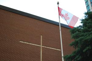 A Canadian flag is seen flying at a Catholic school in Toronto. A Canadian flag is seen flying at a Catholic school in Toronto.