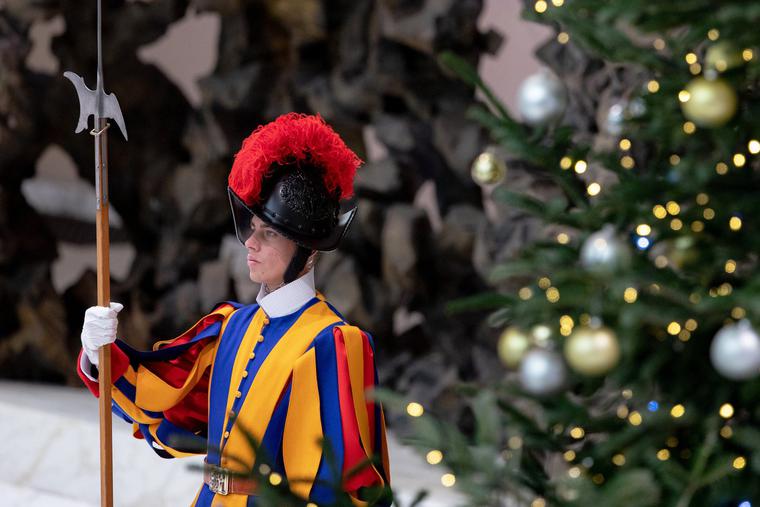A Swiss Guard stands watch near a Christmas tree in the Paul VI Audience Hall during the Pope’s weekly general audience on Dec. 1. A Swiss Guard stands watch near a Christmas tree in the Paul VI Audience Hall during the Pope’s weekly general audience on Dec. 1.