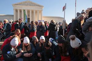 Students from Liberty University sit and pray in front of the U.S. Supreme Court as the justices hear hear arguments in Dobbs v. Jackson Women's Health, a case about a Mississippi law that bans most abortions after 15 weeks, on December 01, 2021 in Washington, DC. Students from Liberty University sit and pray in front of the U.S. Supreme Court as the justices hear hear arguments in Dobbs v. Jackson Women's Health, a case about a Mississippi law that bans most abortions after 15 weeks, on December 01, 2021 in Washington, DC.