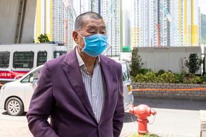 Hong Kong media tycoon and founder of Apple Daily newspaper Jimmy Lai Chee Ying arrives at the West Kowloon Magistrates' Court. Hong Kong media tycoon and founder of Apple Daily newspaper Jimmy Lai Chee Ying arrives at the West Kowloon Magistrates' Court.