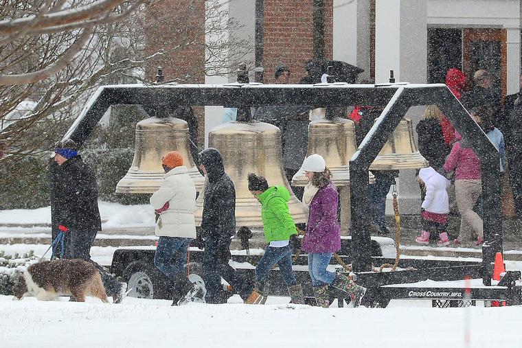 Residents gather outside St. Rose of Lima Church as bells are rung 26 times and the names of the Sandy Hook Elementary shooting victims are called over a loudspeaker, in Newtown, Connecticut, on Dec. 14, 2013. Residents gather outside St. Rose of Lima Church as bells are rung 26 times and the names of the Sandy Hook Elementary shooting victims are called over a loudspeaker, in Newtown, Connecticut, on Dec. 14, 2013.