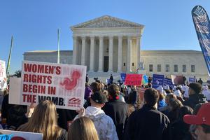 People from across the U.S. gathered outside the Supreme Court Dec. 1 for the oral argument of the ‘Dobbs’ abortion case. One sign proclaims, ‘Women’s rights begin in the womb.’ People from across the U.S. gathered outside the Supreme Court Dec. 1 for the oral argument of the ‘Dobbs’ abortion case. One sign proclaims, ‘Women’s rights begin in the womb.’