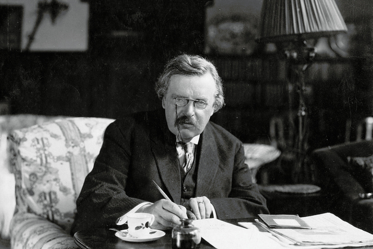 G.K. Chesterton at his desk. G.K. Chesterton at his desk.