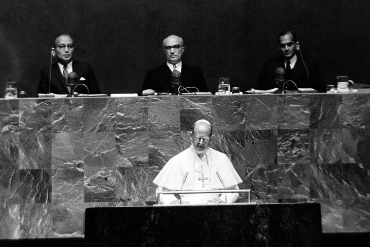 Pope Paul VI addresses to the U.N. General Assembly in New York, Oct. 4, 1965. Seated behind him, from left are: U.N. Secretary General U Thant; General Assembly President Amintore Fanfani and C.V. Narasimhan, U.N. Undersecretary for General Assembly Affairs. Pope Paul VI addresses to the U.N. General Assembly in New York, Oct. 4, 1965. Seated behind him, from left are: U.N. Secretary General U Thant; General Assembly President Amintore Fanfani and C.V. Narasimhan, U.N. Undersecretary for General Assembly Affairs.