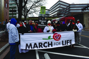 Above, organizers and a limited number of participants prepare to march in the March for Life in Washington on Jan. 29, 2021. Above, organizers and a limited number of participants prepare to march in the March for Life in Washington on Jan. 29, 2021.