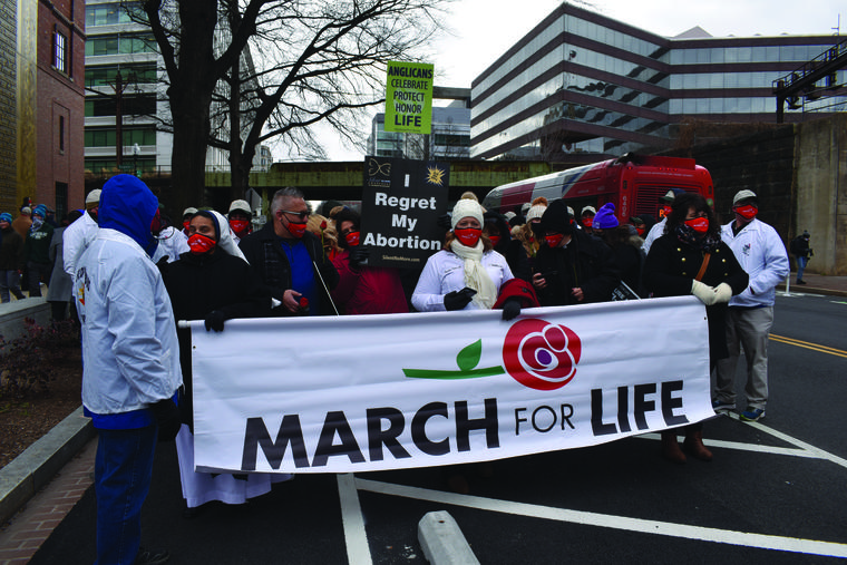 Above, organizers and a limited number of participants prepare to march in the March for Life in Washington on Jan. 29, 2021. Above, organizers and a limited number of participants prepare to march in the March for Life in Washington on Jan. 29, 2021.