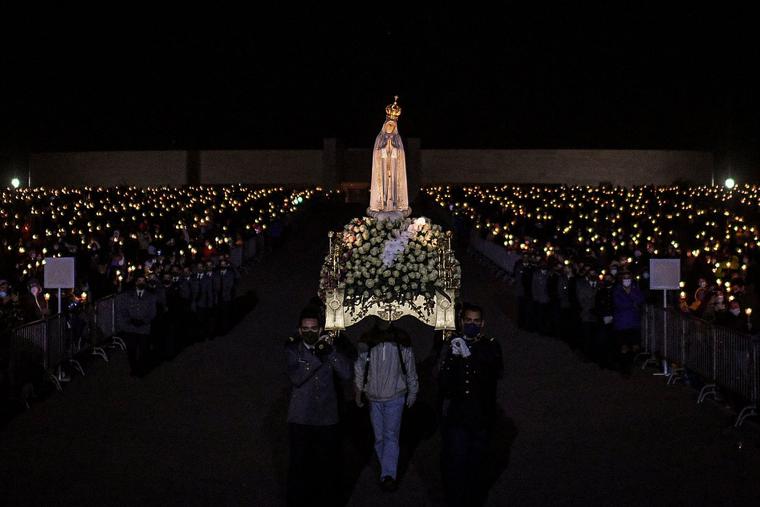 The statue of Our Lady of Fatima is carried during the candlelight procession in the annual Fatima pilgrimage at the Fatima shrine in central Portugal. The statue of Our Lady of Fatima is carried during the candlelight procession in the annual Fatima pilgrimage at the Fatima shrine in central Portugal.