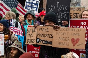 Demonstrators for and against vaccine mandates and passports picket outside the the State House in Boston on Jan. 5 Demonstrators for and against vaccine mandates and passports picket outside the the State House in Boston on Jan. 5