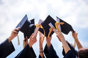 Grads throw their hats into the air after commencement ceremony. Grads throw their hats into the air after commencement ceremony.