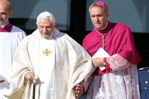 Pope Emeritus Benedict XVI, flanked by personal secretary Archbishop Georg Ganswein (r) arrives at the holy Mass for the closing of the Extraordinary Synod held by Pope Francis at St. Peter's Square on Oct. 19, 2014, in Vatican City. Pope Emeritus Benedict XVI, flanked by personal secretary Archbishop Georg Ganswein (r) arrives at the holy Mass for the closing of the Extraordinary Synod held by Pope Francis at St. Peter's Square on Oct. 19, 2014, in Vatican City.