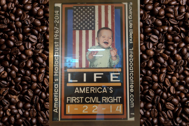 Poster inside Lifeboat Coffee, owned by John Lillis, featuring his daughter. Poster inside Lifeboat Coffee, owned by John Lillis, featuring his daughter.