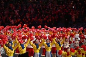 Performers wave upon the arrival of China's President Xi Jinping (not pictured) before the start of the opening ceremony of the Beijing 2022 Winter Olympic Games, at the National Stadium, known as the Bird's Nest, in Beijing, on February 4, 2022. Performers wave upon the arrival of China's President Xi Jinping (not pictured) before the start of the opening ceremony of the Beijing 2022 Winter Olympic Games, at the National Stadium, known as the Bird's Nest, in Beijing, on February 4, 2022.