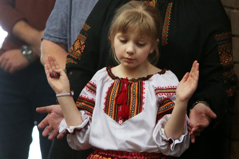 A young girl prays at St. Andrew's Ukrainian Catholic Church in Sydney, Australia, on Sunday. A young girl prays at St. Andrew's Ukrainian Catholic Church in Sydney, Australia, on Sunday.