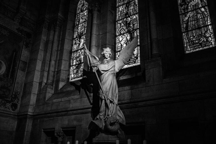 Statue inside Sacré-Cœur in Paris, France. Statue inside Sacré-Cœur in Paris, France.
